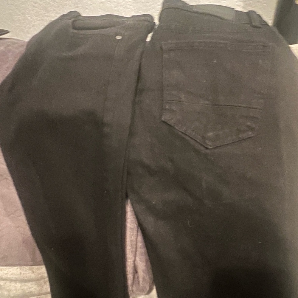 2 pairs of black skinny jeans.